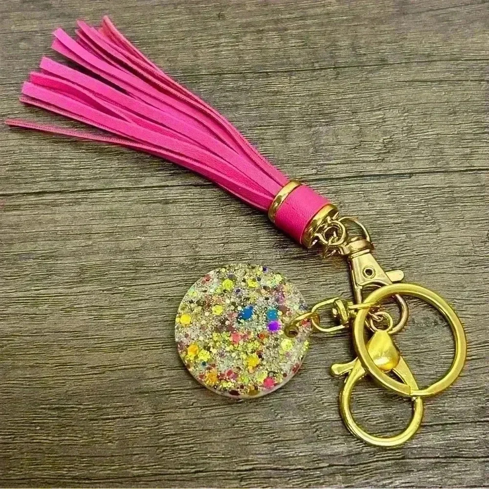 Gold Tone Keychain with Hand Crafted Sparkles Amulet and Hot Pink Tassel